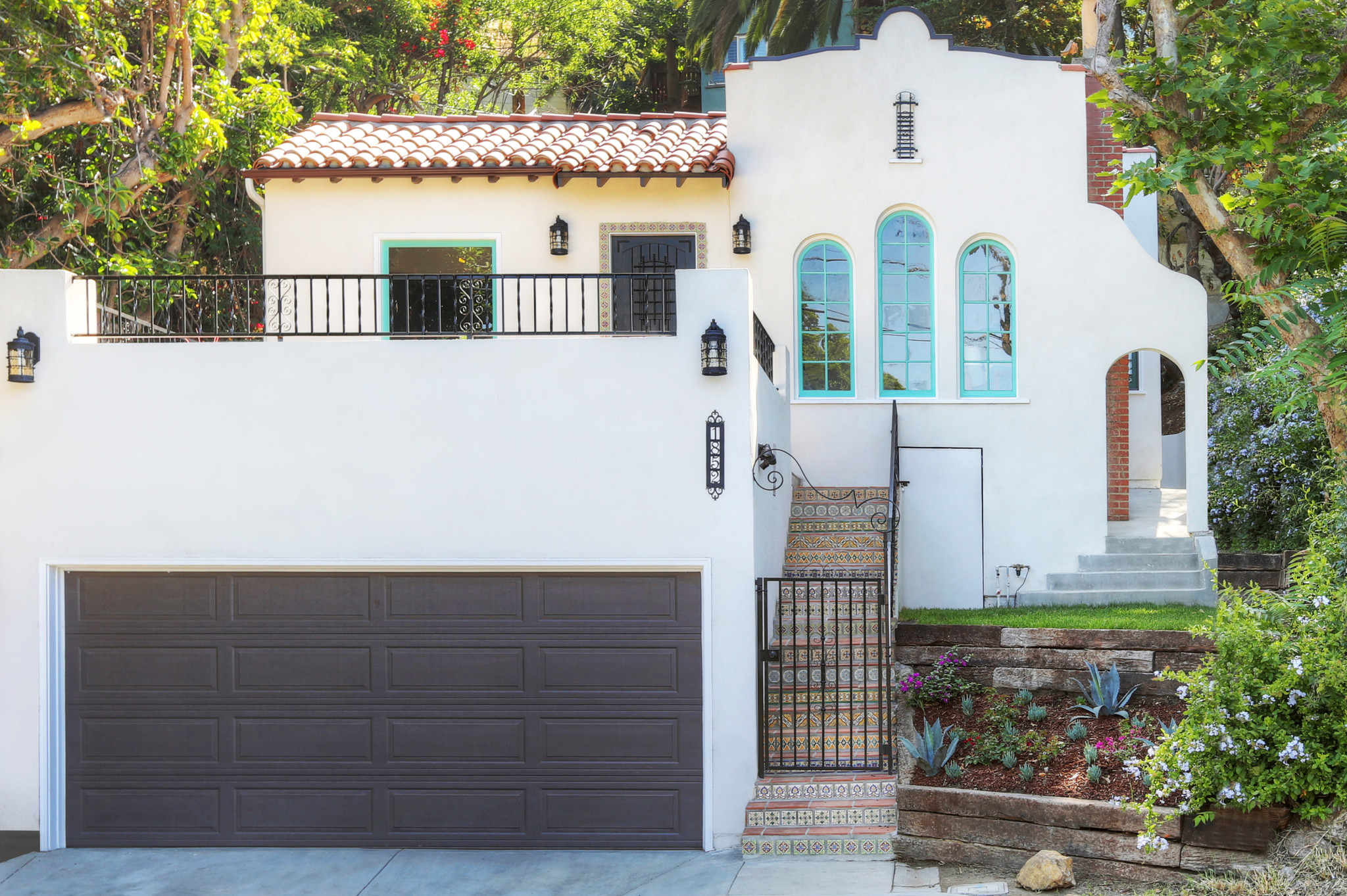 real estate development, spanish revival, los feliz, los angeles, white stucco, teal windows, spanish colonial, hand painted tile