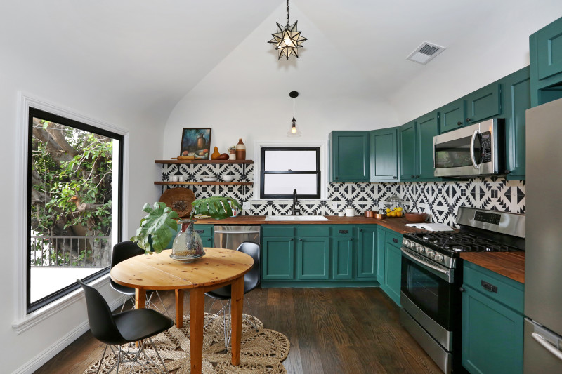 real estate development, spanish revival, los feliz, los angeles, white stucco, teal windows, spanish colonial, hand painted tile